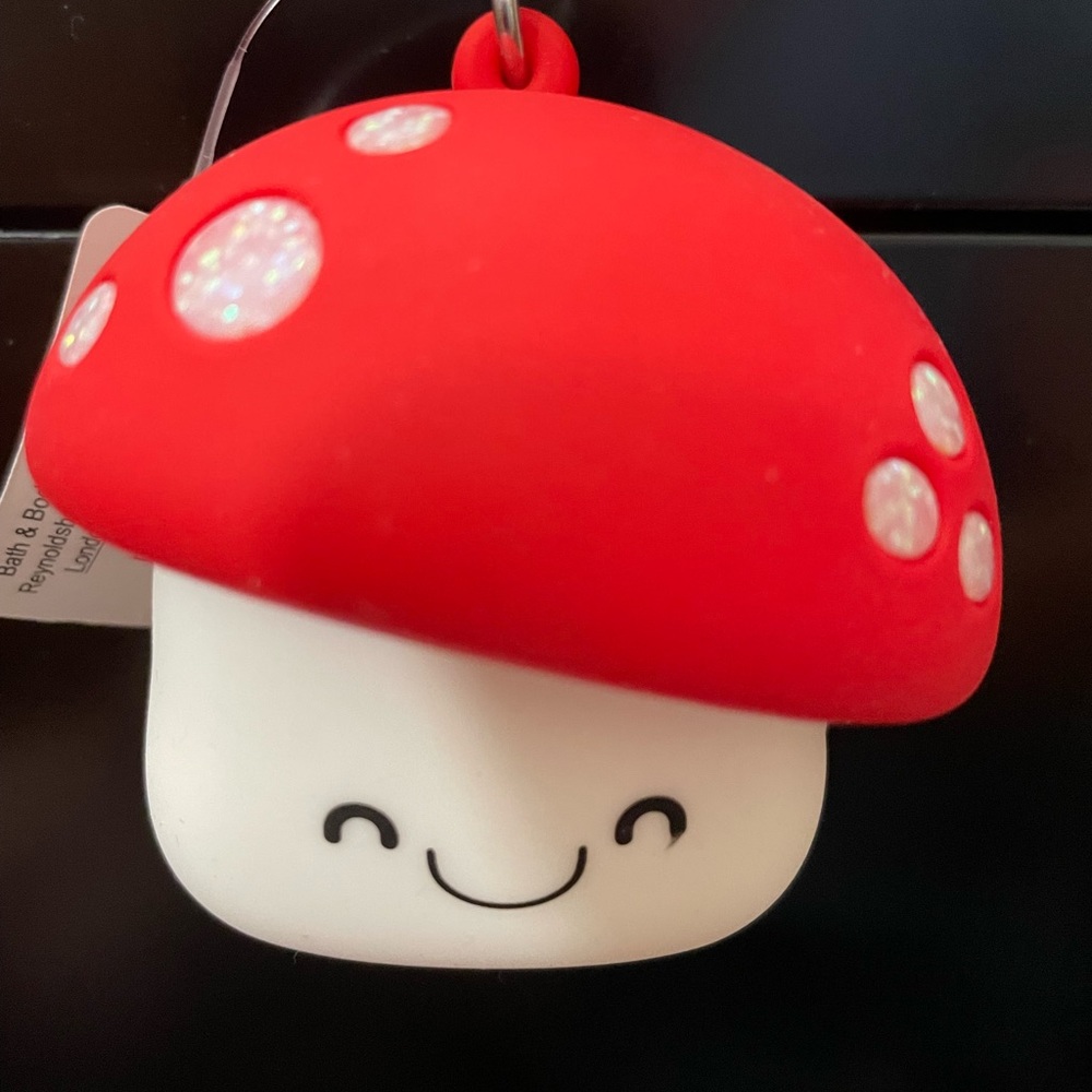 Cute mushroom pocketbac hand sanitizer holder.